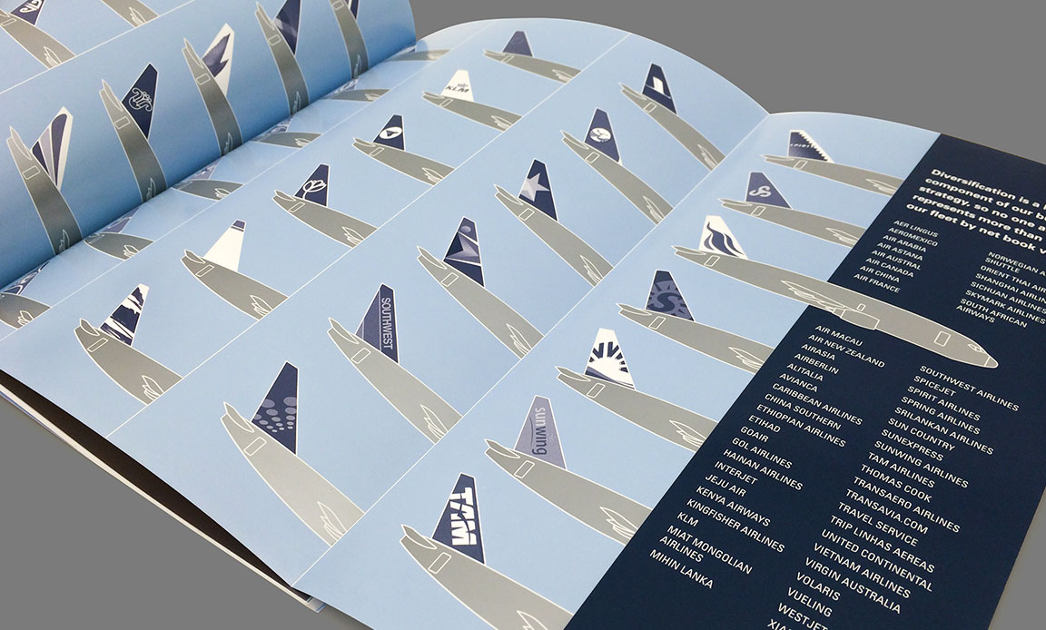 Corporate report design of airplane tail graphics on interior spread.