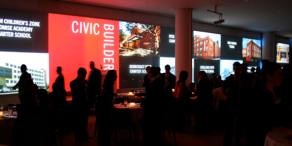 Civic Builders visual identity and design wall graphics projected during a fundraising event.